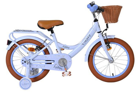 Weißes Kinderfahrrad mit braunem Korb und Reifen in Braun