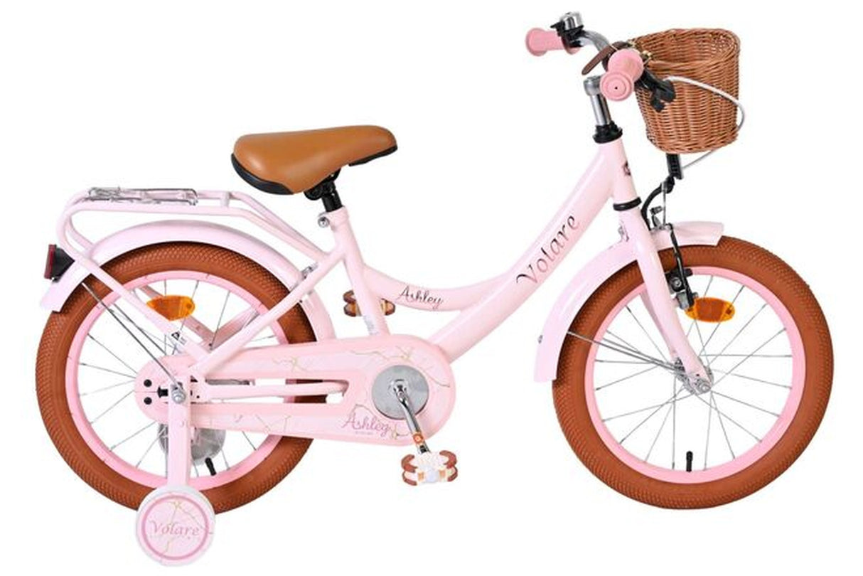 Rosa Kinderfahrrad mit Korb und braunen Reifen