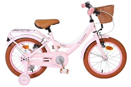 Rosa Kinderfahrrad mit Korb, braunen Reifen und bequemer Sitzfläche