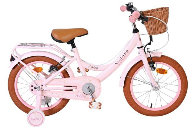 Rosa Kinderfahrrad mit Korb und braunen Reifen