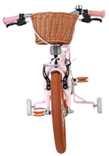 Rosa Kinderfahrrad mit Korb und orangefarbenen Reifen