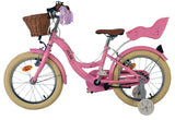 Rosa Kinderfahrrad mit Korb, Sattel und Stützrädern