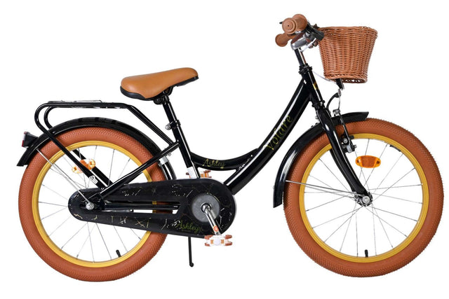 Schwarzes Kinderfahrrad mit braunen Reifen und Korb vorne