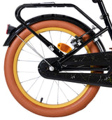 Schwarzes Fahrrad mit braunem Reifen und reflektierendem Rücklicht