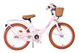 Rosa Kinderfahrrad mit Korb und braunen Reifen