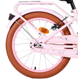 Faltbares Fahrrad mit braunem Reifen und pinkem Rahmen