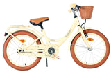 Beige Damenfahrrad mit Korb und braunen Reifen