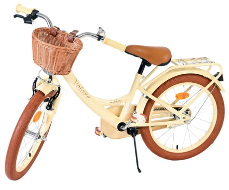 Beige Damenfahrrad mit Korb, braunen Reifen und bequemen Griffen