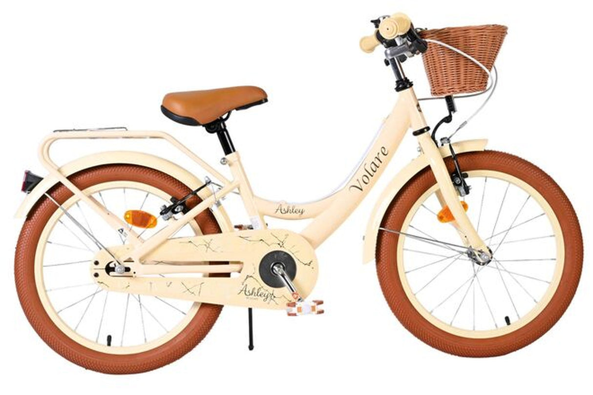 Beige Kinderfahrrad mit Korb, braunen Reifen und gepolsterter Sitzfläche