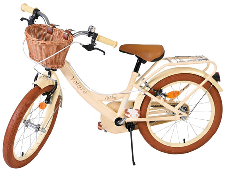 Beige Damenfahrrad mit Korb, braunen Reifen und bequemen Sattel