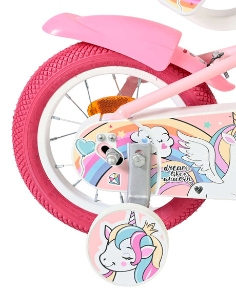 Rosa Kinderfahrrad mit Einhorn-Motiv und bunten Reifen