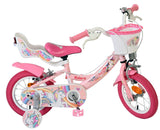 Rosa Kinderfahrrad mit Einhorn-Motiven und Korb vorne
