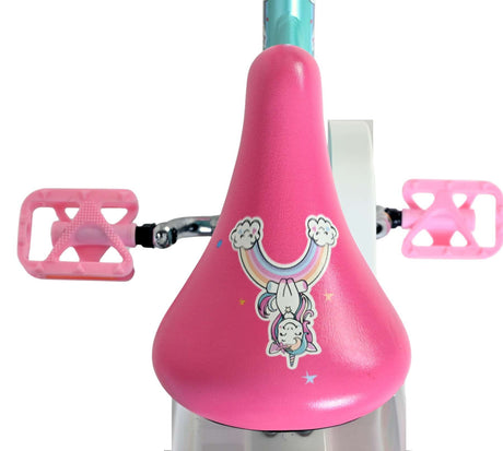 Rosa Fahrradsattel mit Einhorn-Motiv und buntem Regenbogen