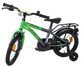Kinderfahrrad in grün mit Stützrädern und Gepäckträger