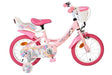 Rosa Kinderfahrrad mit Einhorn-Motiv und Korb vorne