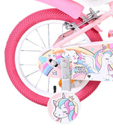 Rosa Kinderfahrrad mit Einhorn-Motiv und bunten Aufklebern