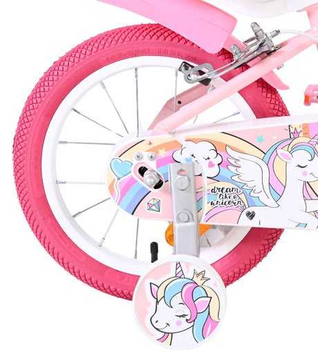 Kinderfahrrad mit pinken Reifen und Einhorn-Motiv auf dem Rahmen