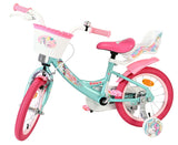 Kinderfahrrad in Türkis mit pinken Akzenten und Korb vorne