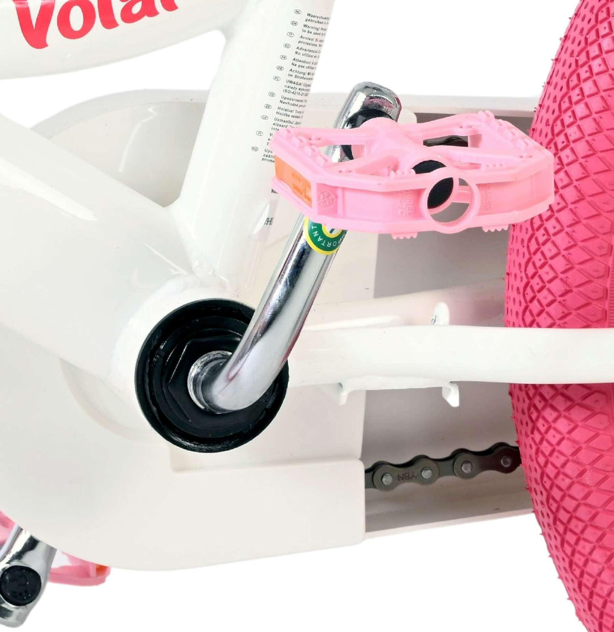 Weißes Fahrrad mit pinken Pedalen und runder pinker Bereifung