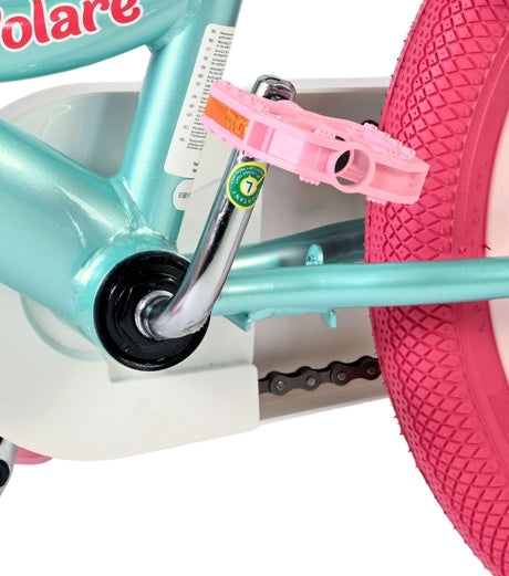 Buntes Kinderfahrrad mit pinken Reifen und Pedalen in Pastellfarbe