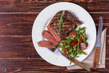 Steak mit Rucola als Beispiel für die Anwendung der Tefal G61237 Schmorpfanne